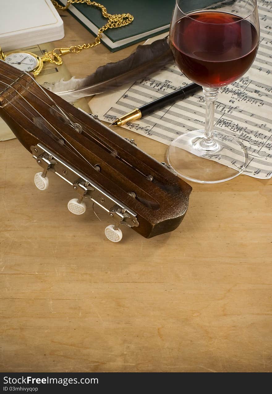 Guitar, Glass Of Wine And Note