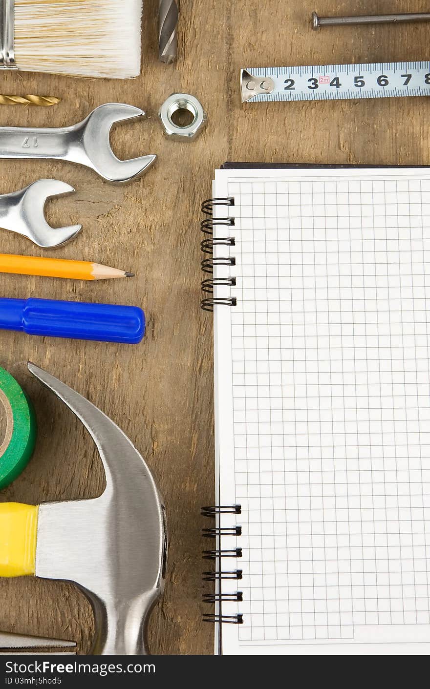 Pad and tools on wooden texture