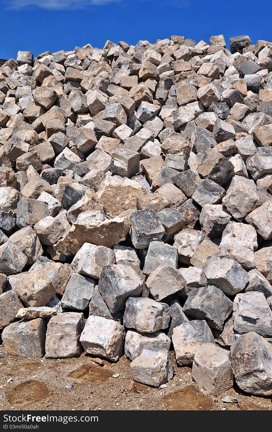 Granite cobble-stones on road building. Granite cobble-stones on road building.