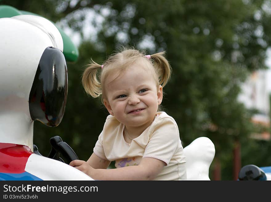 Happy cute little girl in the park. Happy cute little girl in the park