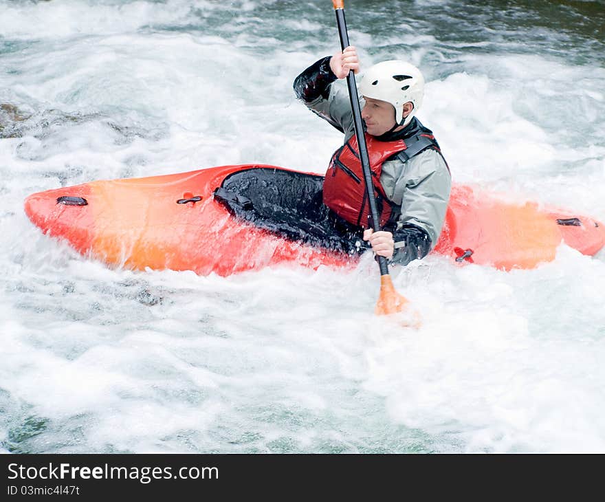 An active kayaker on the rough water