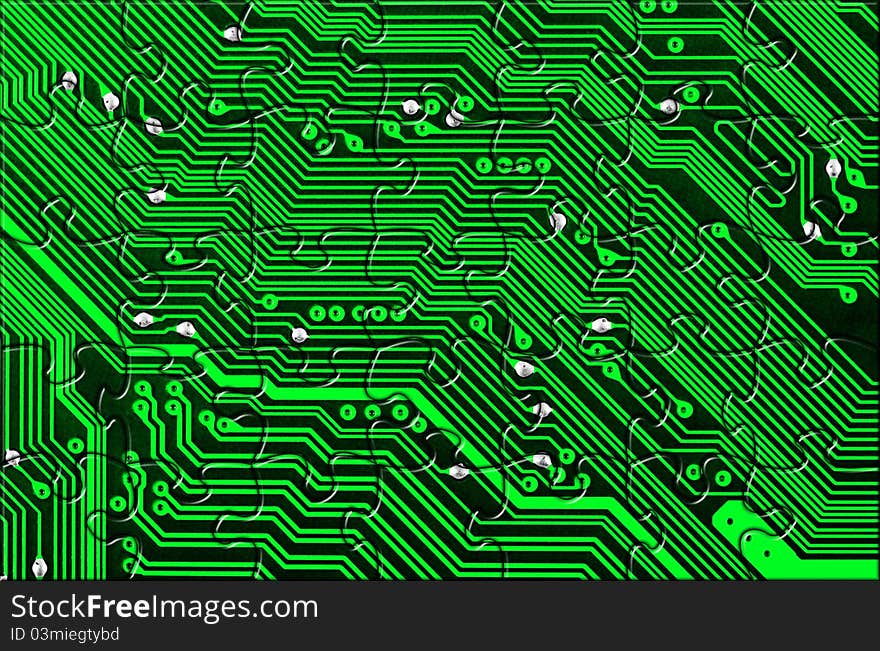 Computer board made of puzzle - technology concept background