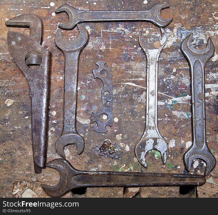 Old isolated rusty tools on wooden background. Old isolated rusty tools on wooden background