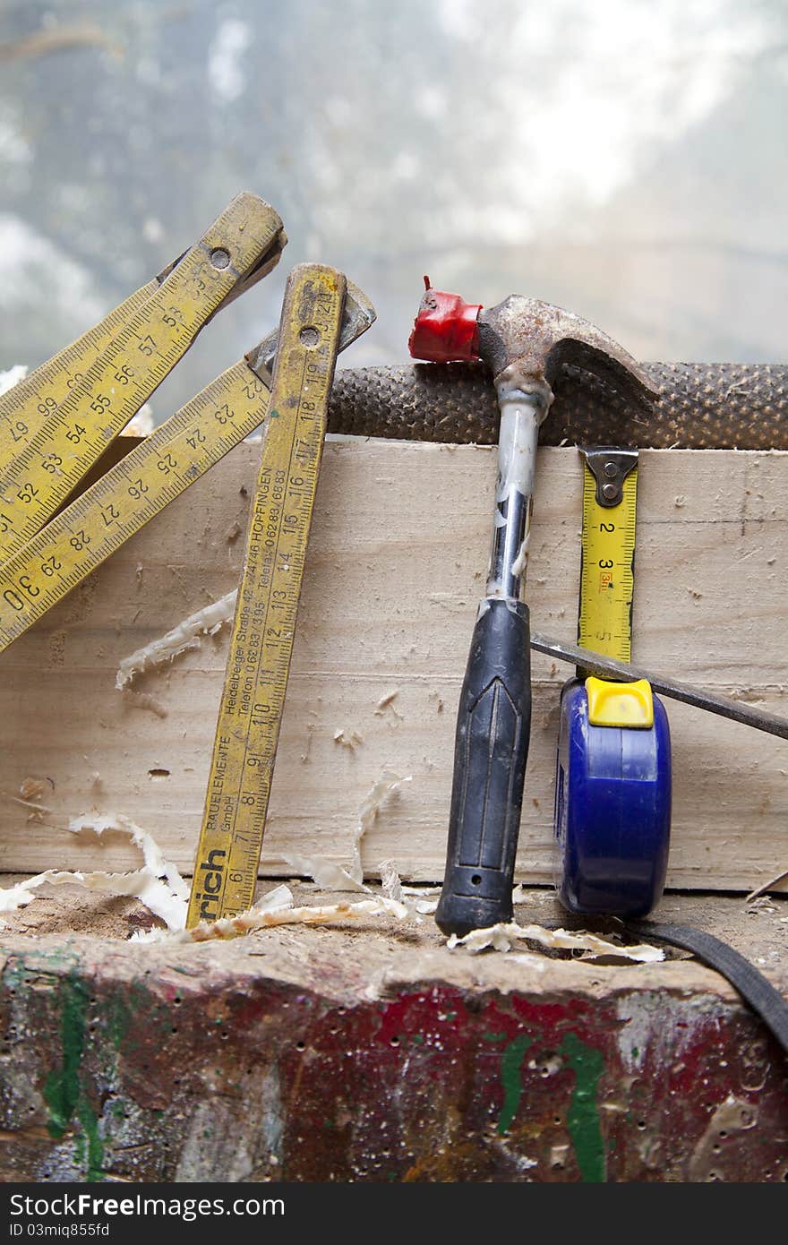 Old carpenter tools on wooden background