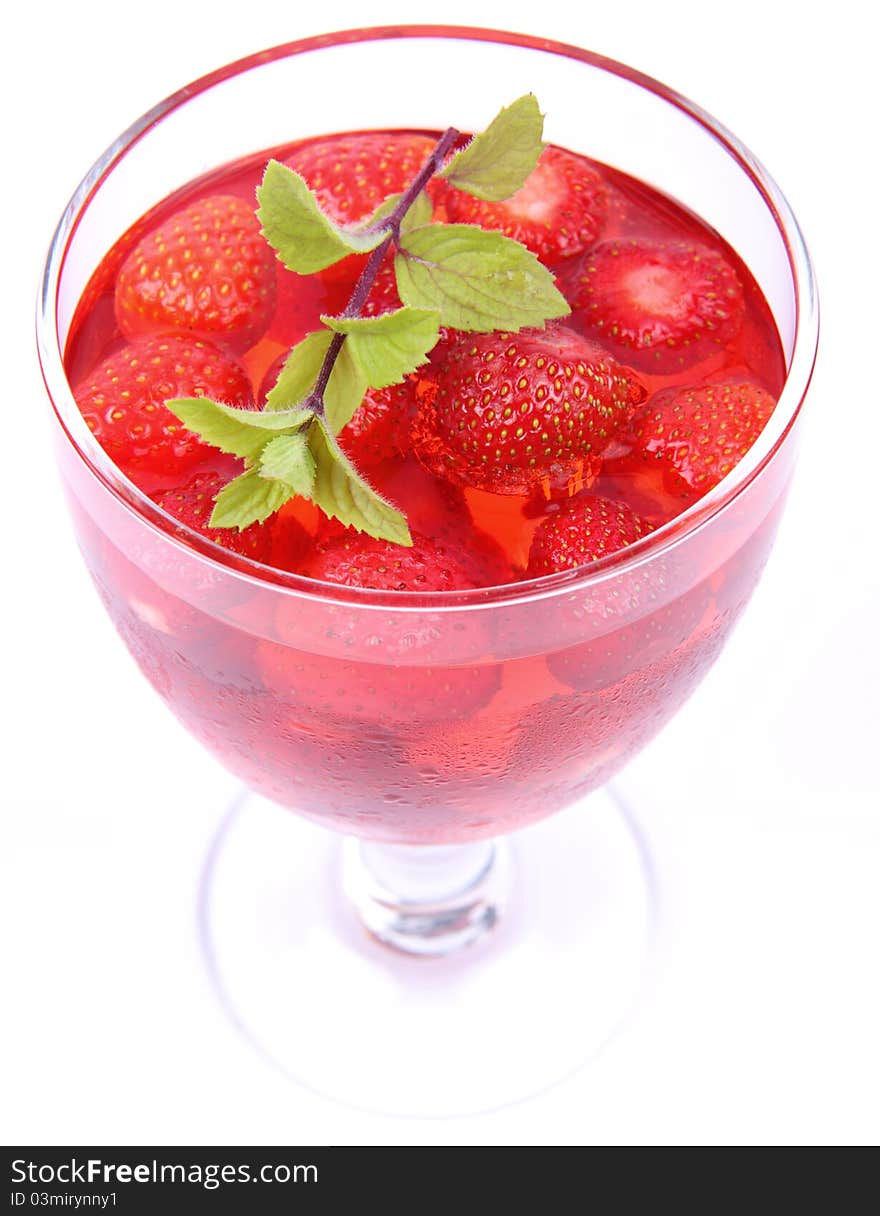 Jelly with strawberries decorated with a mint twig. Jelly with strawberries decorated with a mint twig