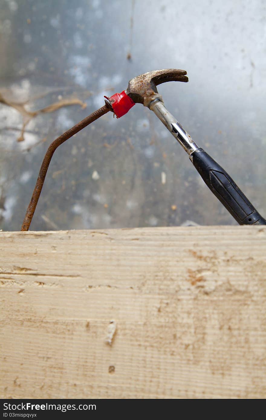 Hammer and bended rusty nail close up. Hammer and bended rusty nail close up