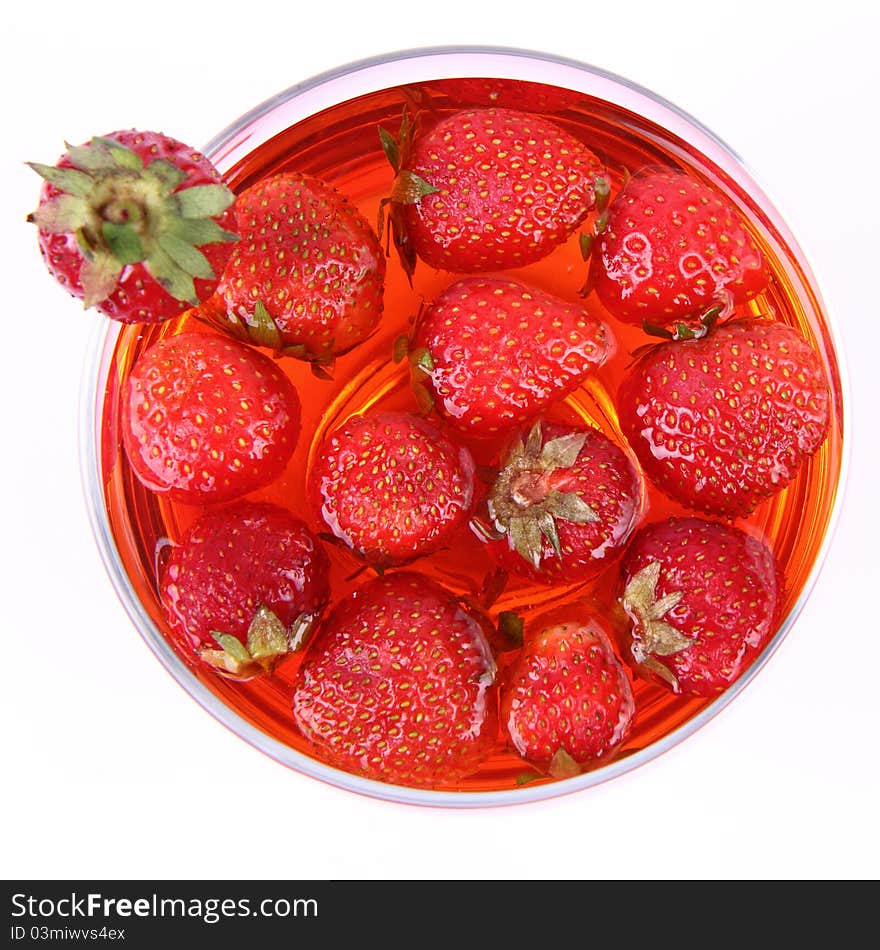 Jelly with strawberries in a glass cup. Jelly with strawberries in a glass cup