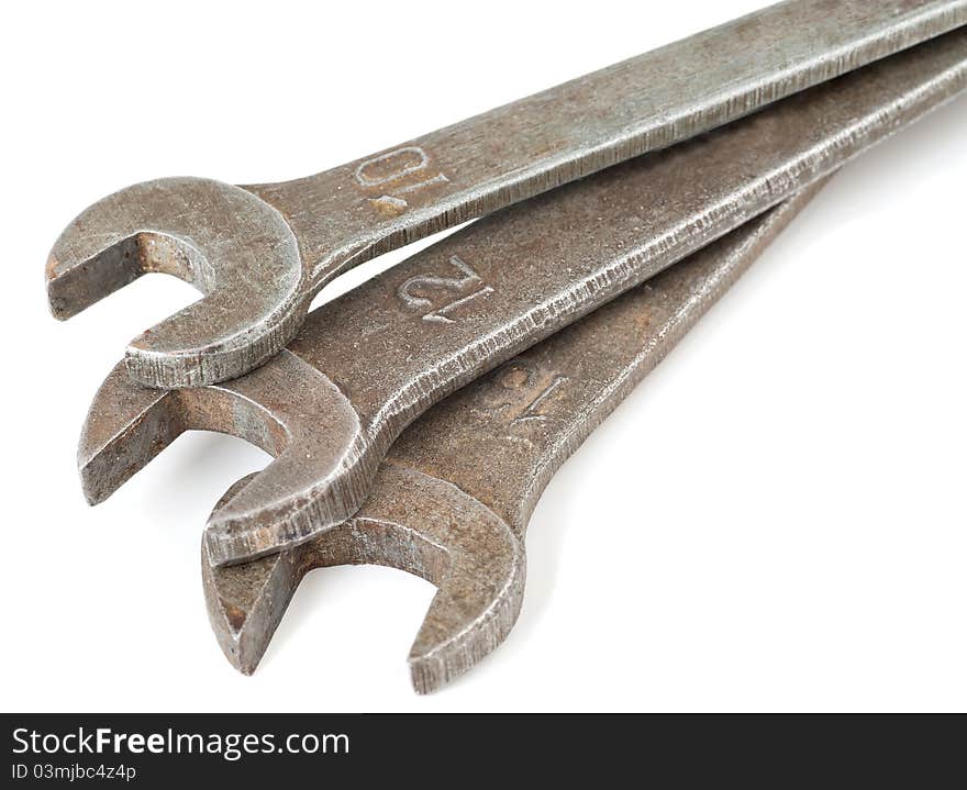 Three metal wrenches on a white background. Three metal wrenches on a white background