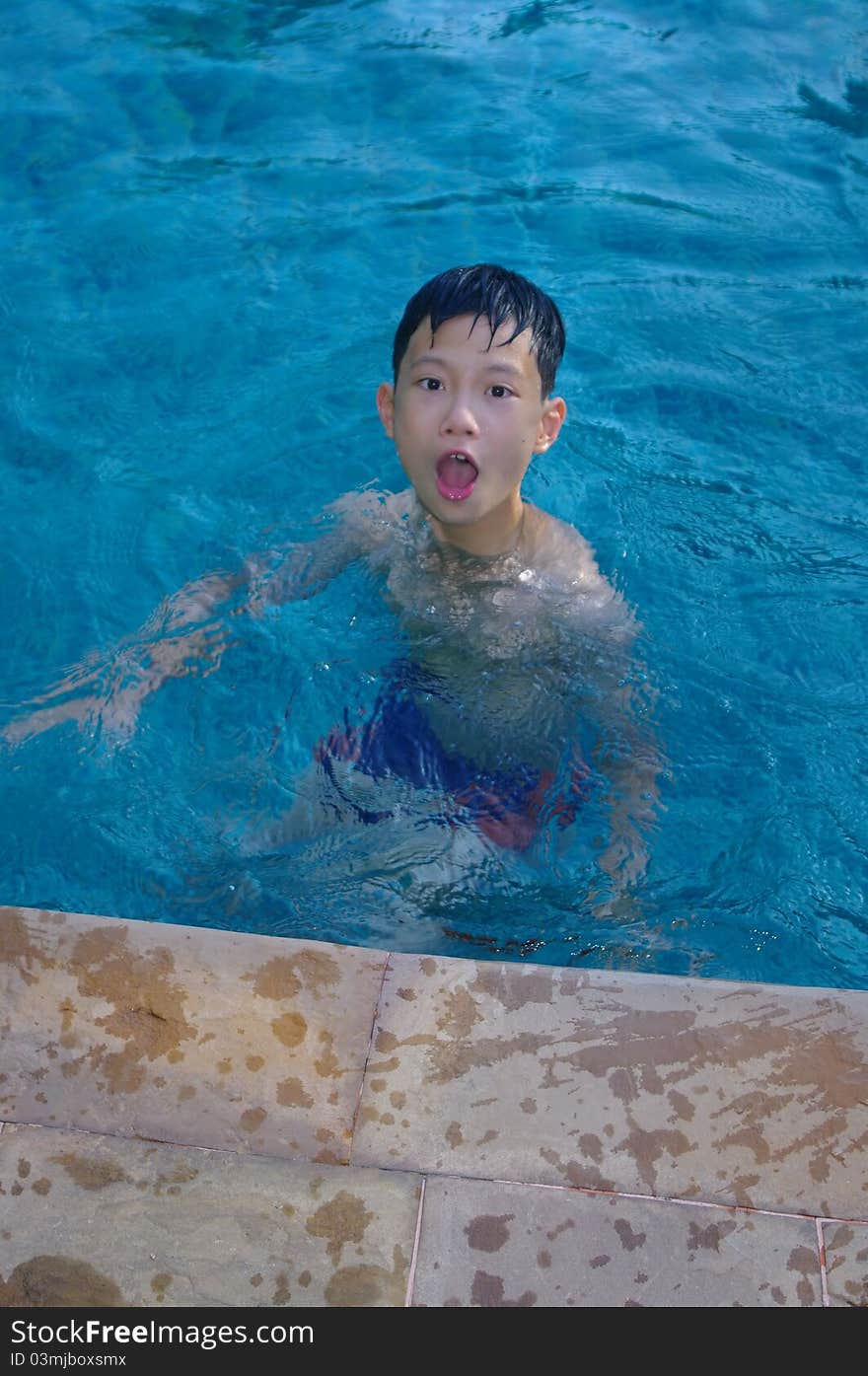 A child playing in the pool. A child playing in the pool.