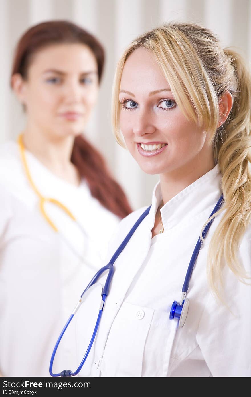 Portrait of two smiling doctors in uniform. Portrait of two smiling doctors in uniform