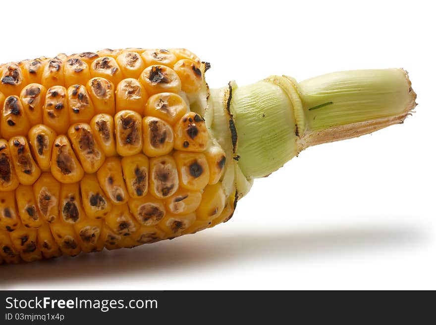 Grilled vegetables: corn. Visible part of the cob. Isolated on a white background. Grilled vegetables: corn. Visible part of the cob. Isolated on a white background.