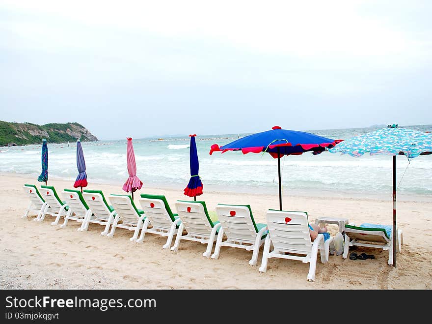 Sun beach chairs and the sea