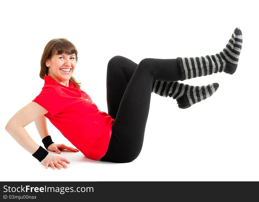 Happy young woman makes fitness exercises isolated over white background. Happy young woman makes fitness exercises isolated over white background