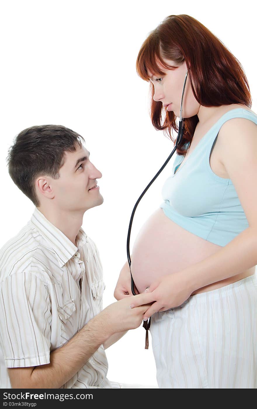 Happy pregnant couple isolated on white background