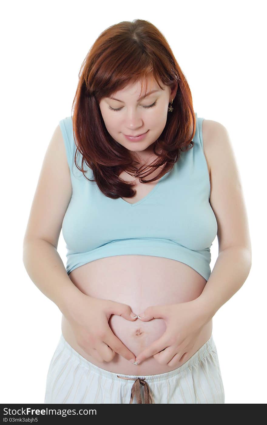 Heart sign on stomach the pregnant woman on white. Heart sign on stomach the pregnant woman on white