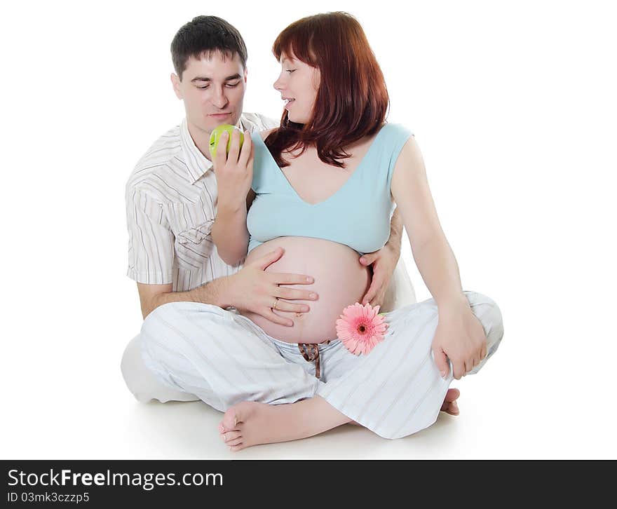 Happy pregnant couple isolated on white