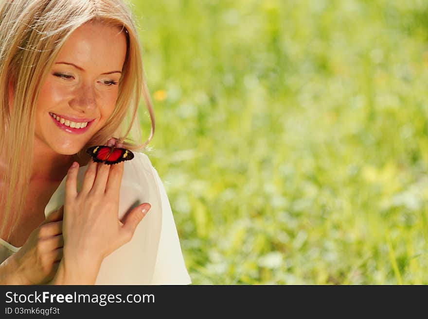 Woman playing with a butterfly