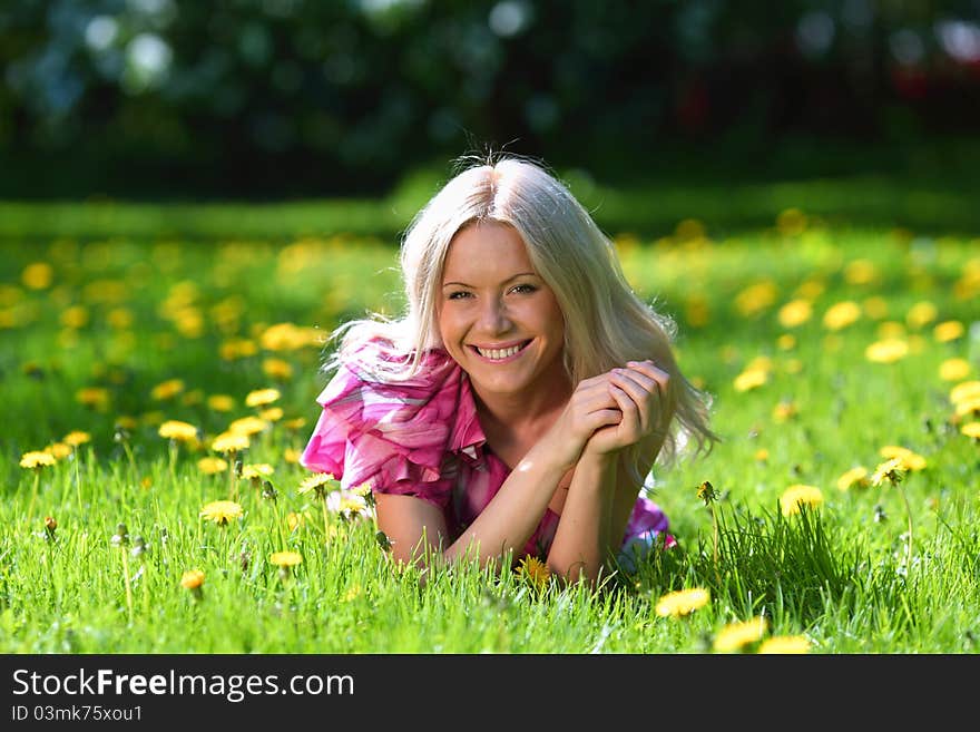 Girl on dandelion field