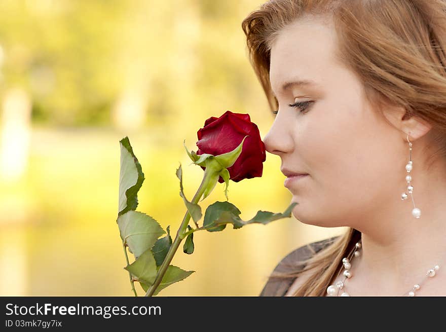 Young woman with a rose