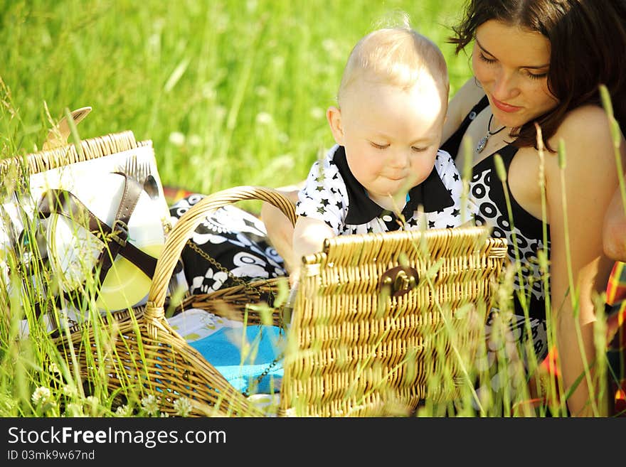 Picnic of happy family on green grass. Picnic of happy family on green grass