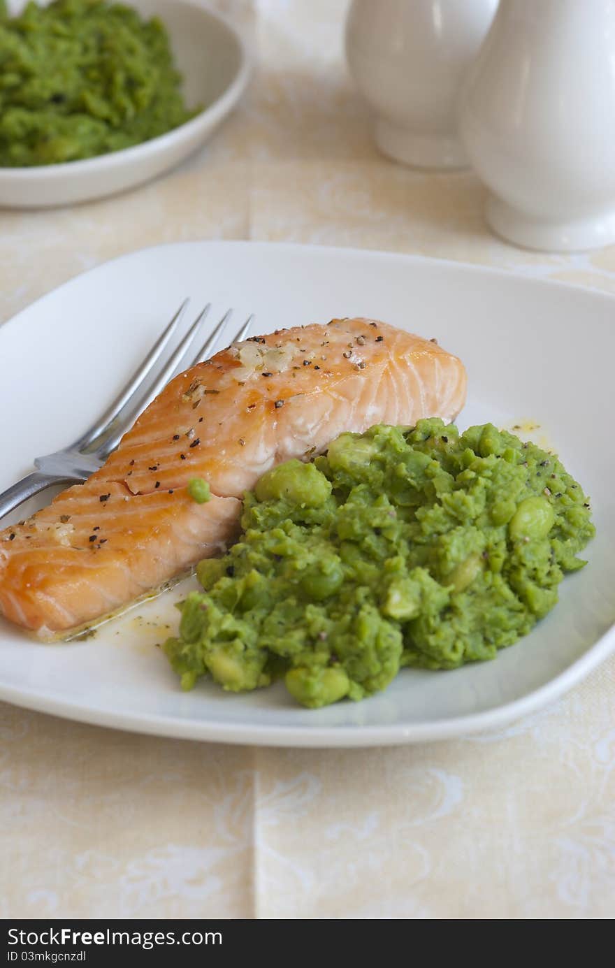 Grilled salmon with crushed minted peas and lemon dressing. Grilled salmon with crushed minted peas and lemon dressing