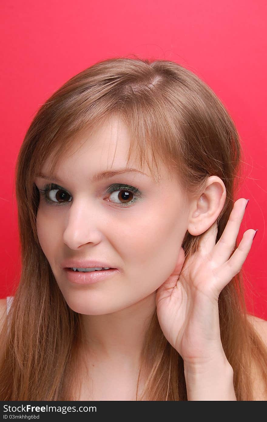 Portrait of a young woman on red