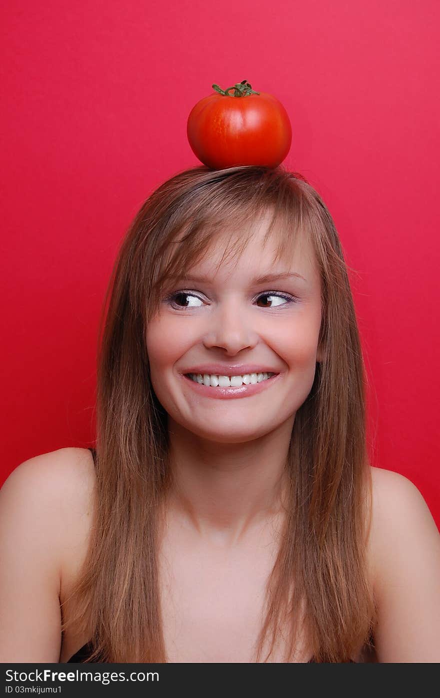 Portrait of a young woman on red