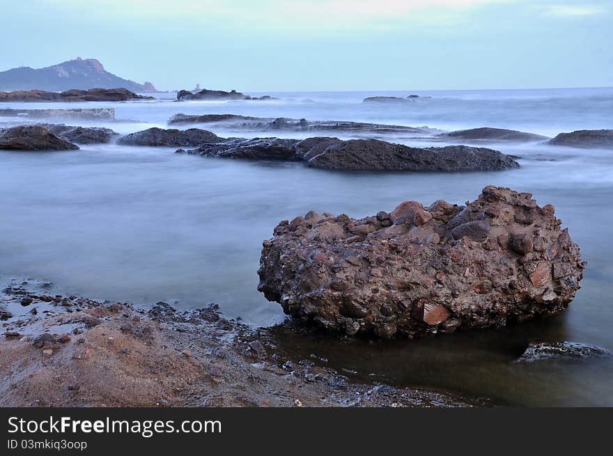 A view of a rock on the mediterranean sea. A view of a rock on the mediterranean sea