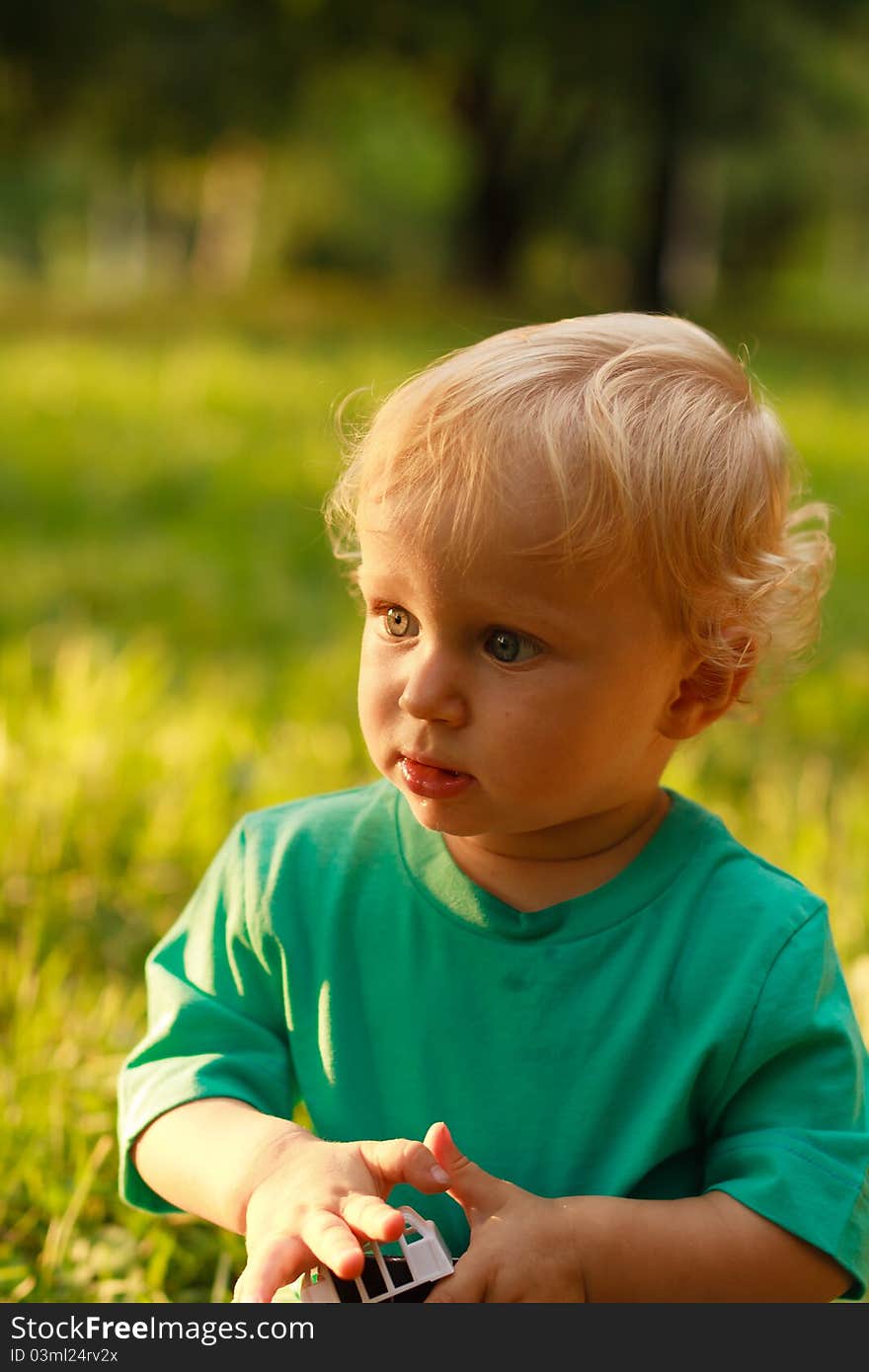 Portrait of serious little boy in summer nature. Portrait of serious little boy in summer nature