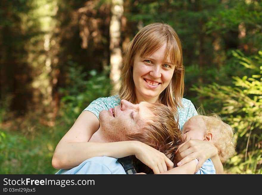 Mother having to care of baby and husband. Mother having to care of baby and husband