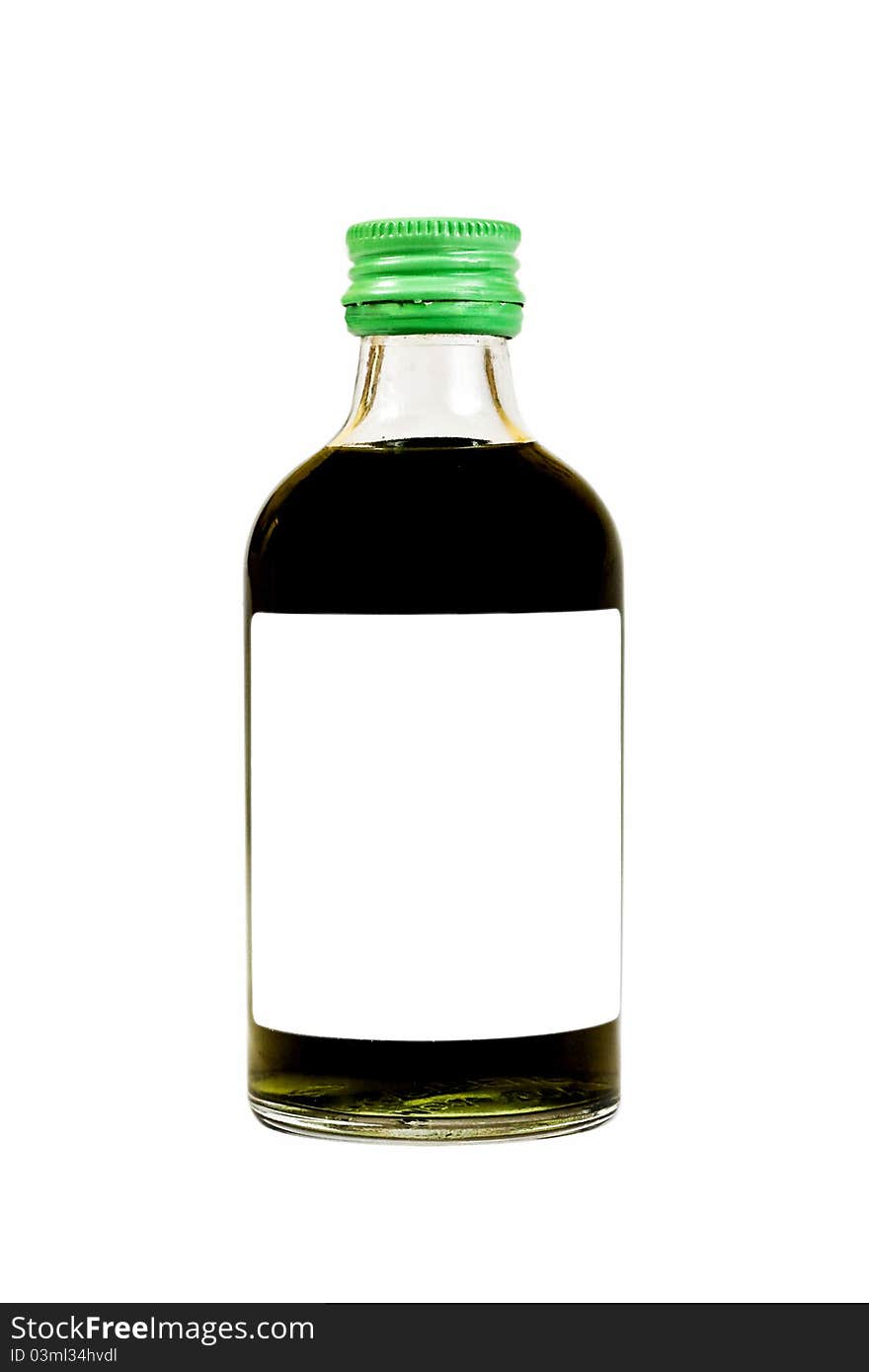 Green liquid in bottle.