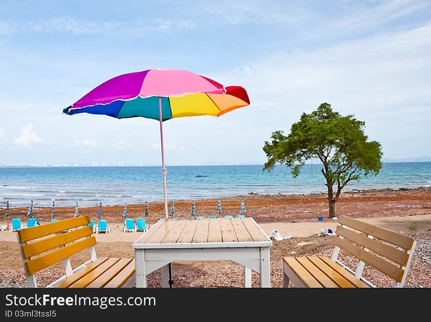 Beach chair and colorful umbrella at  on the beach