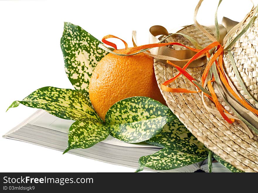 Book, hat and orange