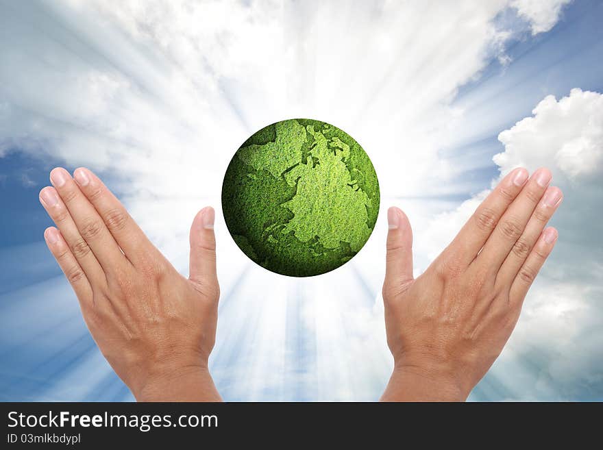 Concept of green globe on shining beam sky. Concept of green globe on shining beam sky.