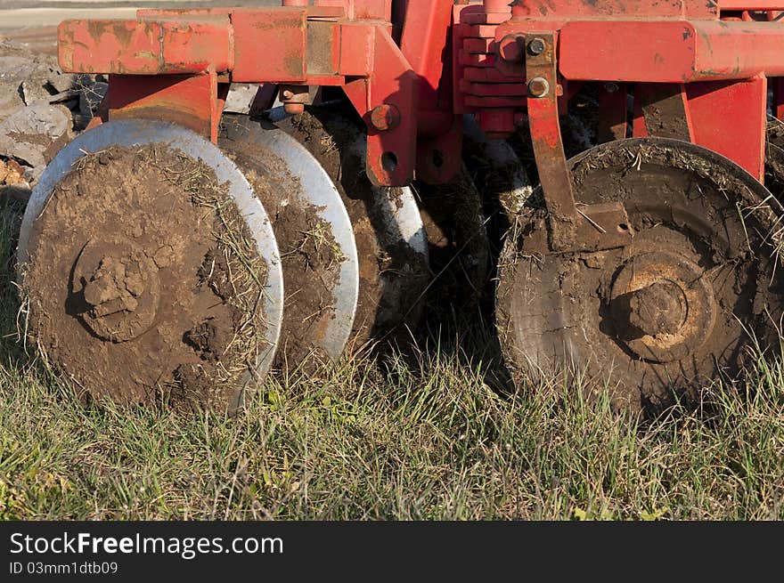 Disk Ripper in the field. Plough is a tool used in farming for initial cultivated of the soil