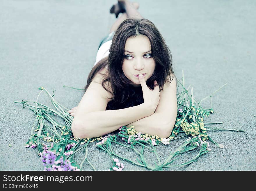 A beautiful brunette in a pensive pose. A beautiful brunette in a pensive pose