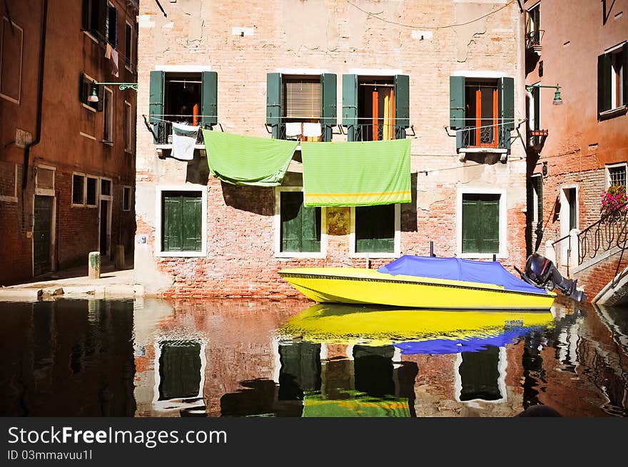 Yellow boat in Venice