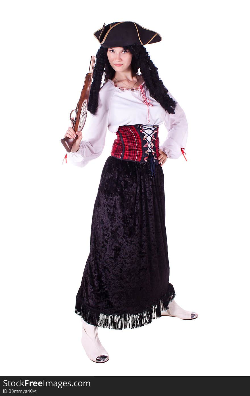 A woman dressed as a pirate, pistol and saber. White background. Studio photography. A woman dressed as a pirate, pistol and saber. White background. Studio photography.