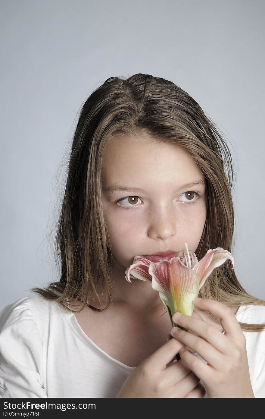 Girl smelling flower