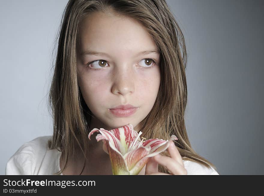 White pretty girl smelling lily. White pretty girl smelling lily