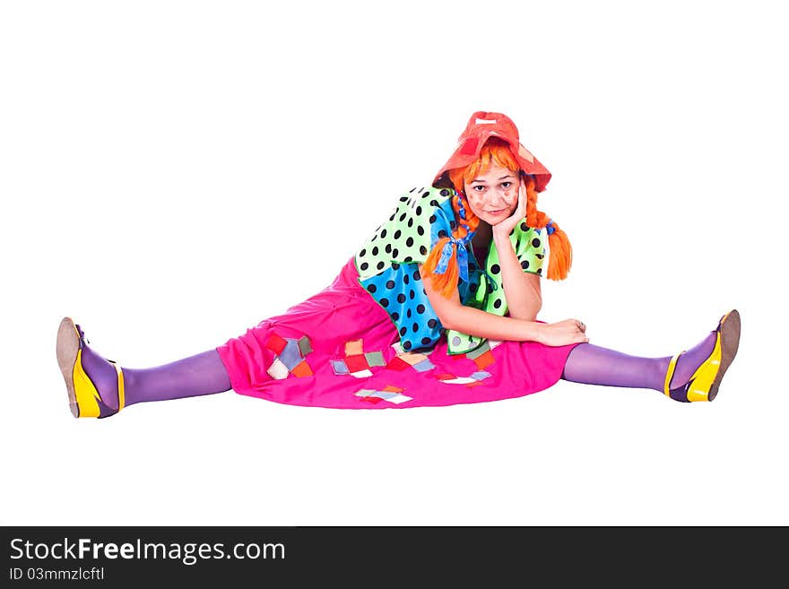 A girl dressed as a clown red. White background. Studio photography. A girl dressed as a clown red. White background. Studio photography.