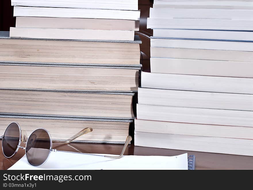 Books and volumes on the table. Books and volumes on the table