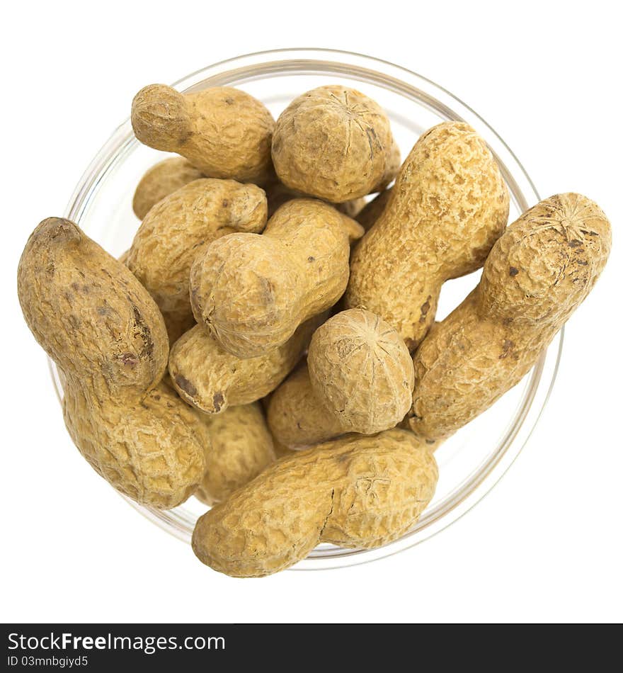 Peanuts in a glass bowl on white