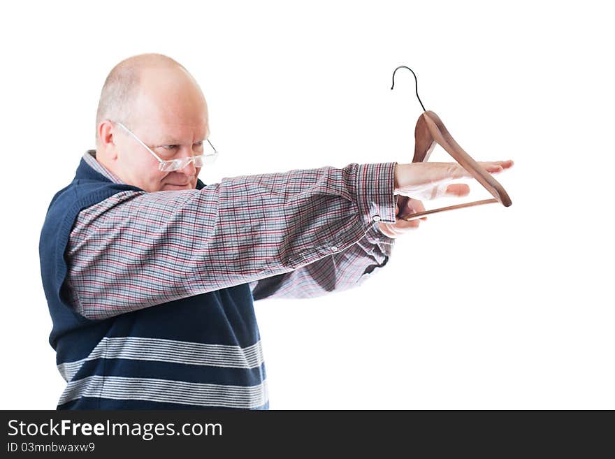 Confident man in glasses measures by hand empty cloth hanger isolated on white. Confident man in glasses measures by hand empty cloth hanger isolated on white