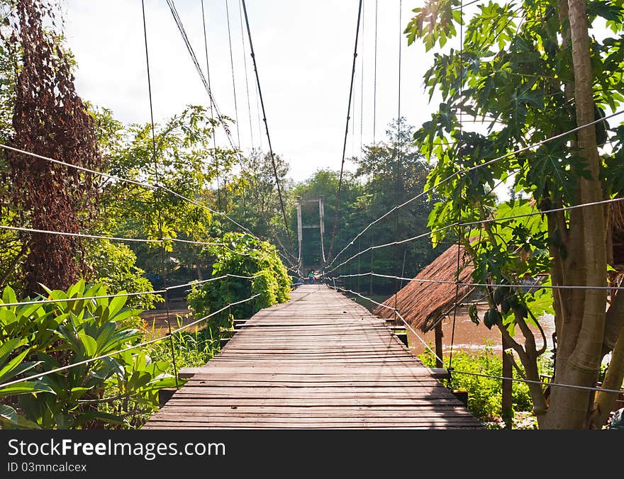 Wooden suspension bridge cross the river