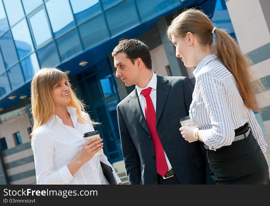 Business people have a coffee break in a modern downtown. Business people have a coffee break in a modern downtown.