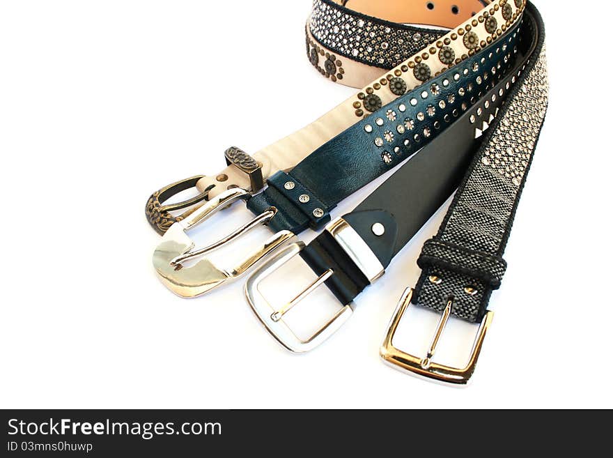 Fashionable belts on white background.