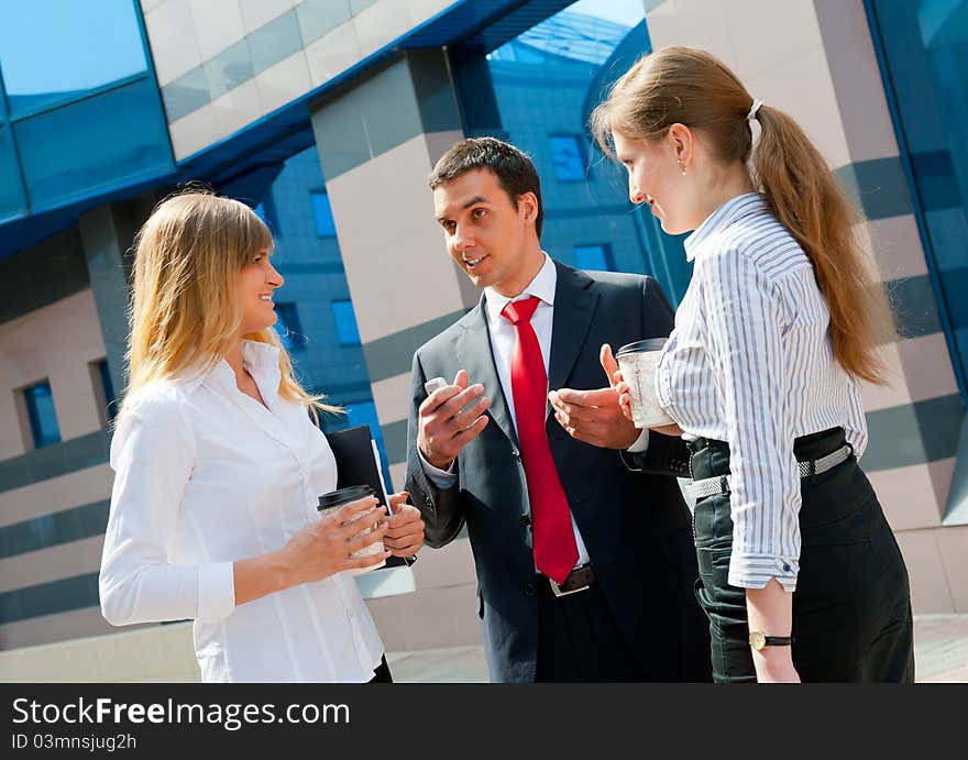 Business people have a coffee break in a modern downtown. Business people have a coffee break in a modern downtown.