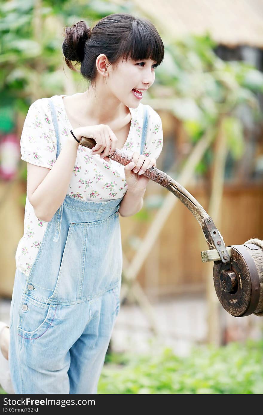 Chinese city girl enjoying the fun of farm life. Chinese city girl enjoying the fun of farm life.