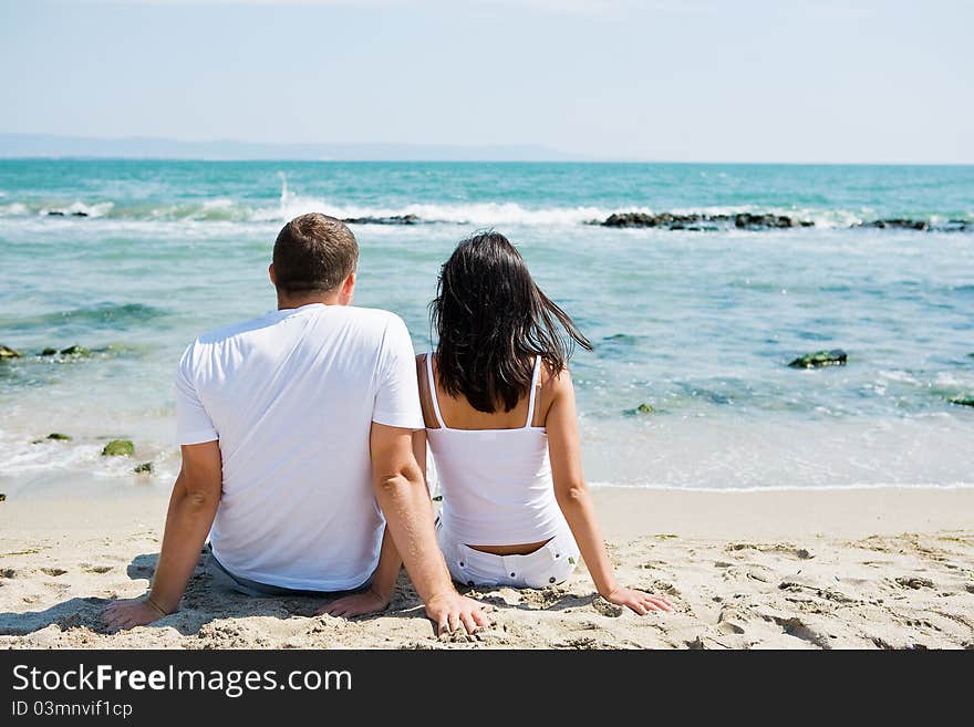 A couple hugging on beach. A couple hugging on beach